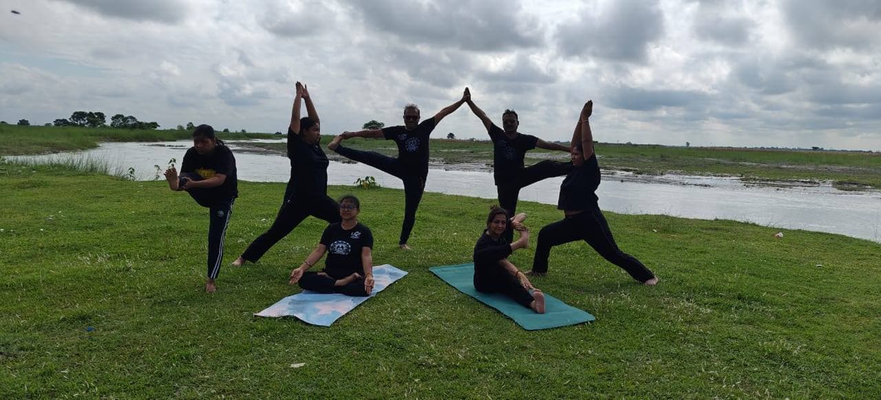 Outdoor yoga session by the lake